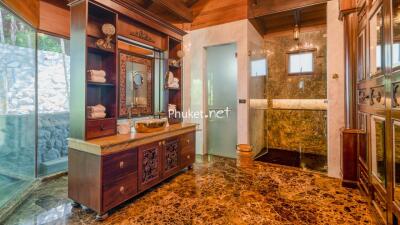 Luxurious Bathroom with Marble Finishes and Wooden Furnishings