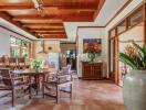 Spacious dining area with wooden ceiling and modern decor