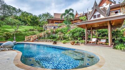 Luxury outdoor area with pool and landscaped garden