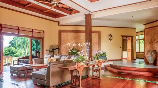 Spacious living room with wooden accents and outdoor view