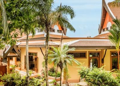 Exterior view of the building with tropical plants