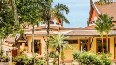 Exterior view of the building with tropical plants