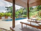 Covered patio area with pool and lush garden view