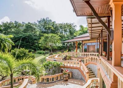 Large terrace with garden view and staircase