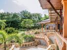 Large terrace with garden view and staircase