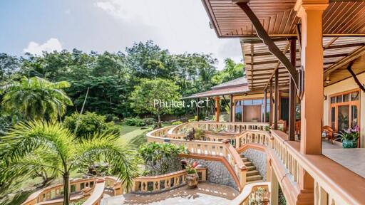 Large terrace with garden view and staircase