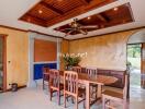 Elegant dining room with wooden ceiling and modern lighting