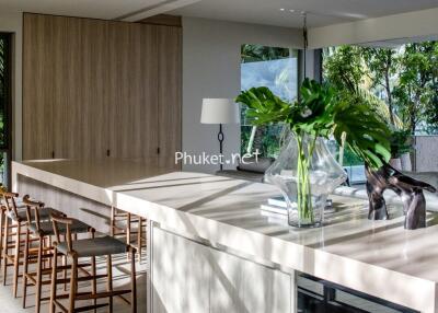 Modern kitchen with large island and stools