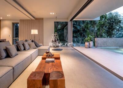 Modern living room with large windows and outdoor space