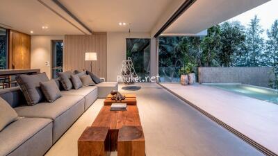 Modern living room with large windows and outdoor space