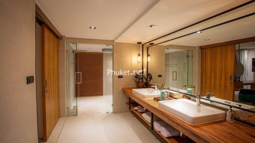 Modern bathroom with double sink vanity and glass shower