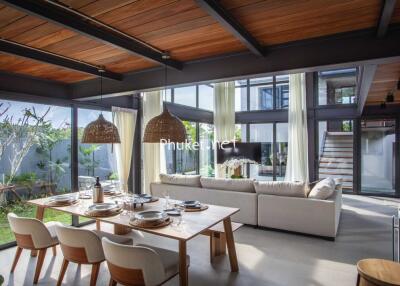 Spacious living room with dining area and large windows