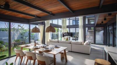 Spacious living room with dining area and large windows