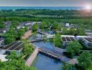 Aerial view of modern residential complex with solar panels and green surroundings