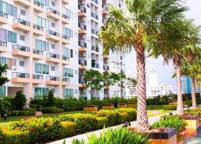 Modern apartment building with lush greenery