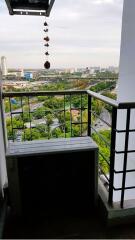 Photo of a balcony with a view of the city and greenery