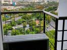 Photo of a balcony with a view of the city and greenery