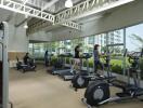 Gym with exercise equipment and people working out