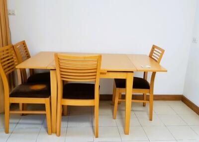 Dining table with four chairs in a corner