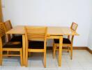 Dining table with four chairs in a corner