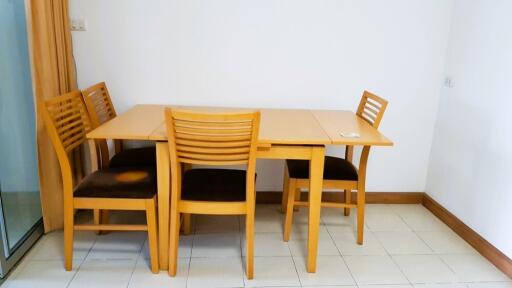 Dining table with four chairs in a corner