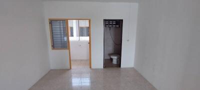 Bathroom and adjacent room with window in a residential property