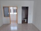 Bathroom and adjacent room with window in a residential property