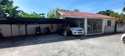 Spacious garage with shaded parking and a sheltered area