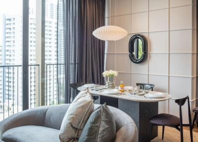 Modern living room with a view of the city and dining area