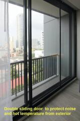 Modern balcony with city view and double sliding glass door