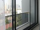 Modern balcony with city view and double sliding glass door