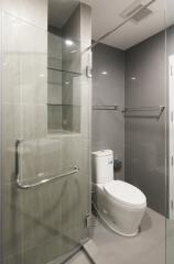 Modern bathroom with glass shower and toilet