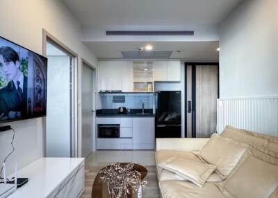 Modern living room with beige sofa and TV