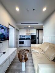 Modern living room with beige sofa and TV