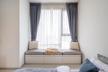 Cozy bedroom with window seating area