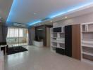 Modern living room with built-in shelves and LED lighting