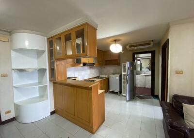 Modern kitchen with wooden cabinets and appliances