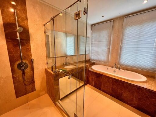 Modern bathroom with glass shower and bathtub