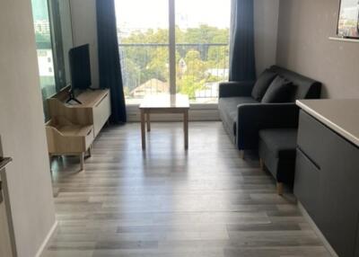 Modern living room with large window and balcony view