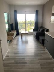 Modern living room with large window and balcony view