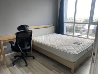 Modern bedroom with desk and chair