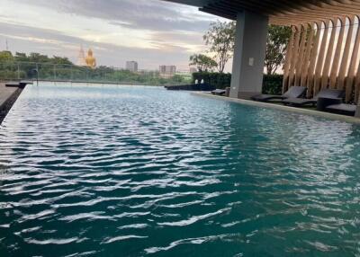 Outdoor swimming pool with cityscape view