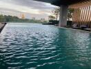 Outdoor swimming pool with cityscape view