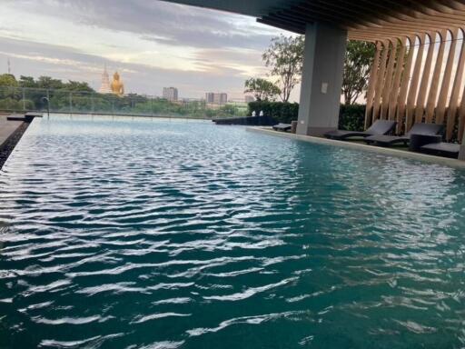 Outdoor swimming pool with cityscape view