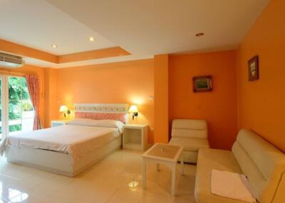 Spacious bedroom with double bed and seating area