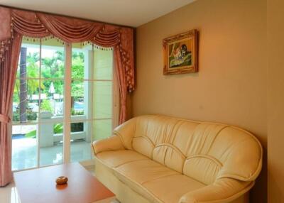 Cozy living room with large window and comfortable seating