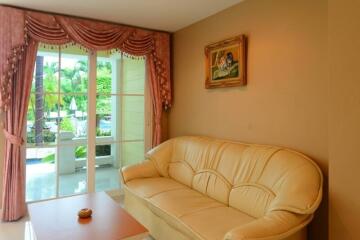 Cozy living room with large window and comfortable seating