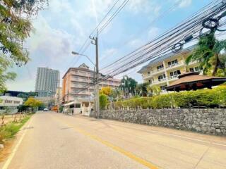 Street view of residential buildings and surrounding area