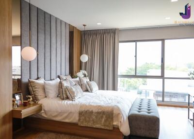 Modern and stylish bedroom with large windows and contemporary decor