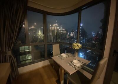 Cozy dining area with a night city view